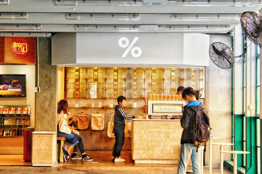 people standing in front of brown wooden table